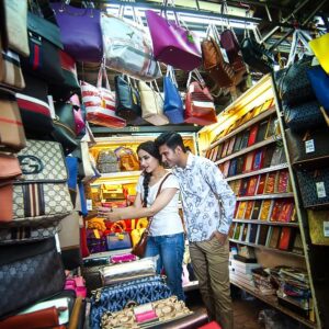buying fake handbags in the chinatown kuala lumpur during the night city tour