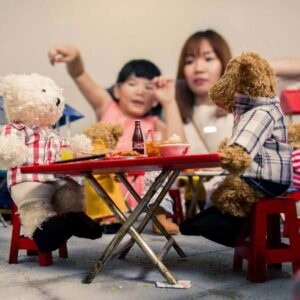 mom and kids in the teddy ville museum with discount ticket access