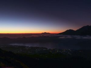 the view of mount batur in bali during a sunset tour