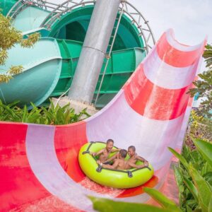 3 kids on a water slide at the ramayana pattaya water park