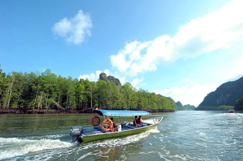 boat taking passengers during an island hopping trip package langkawi