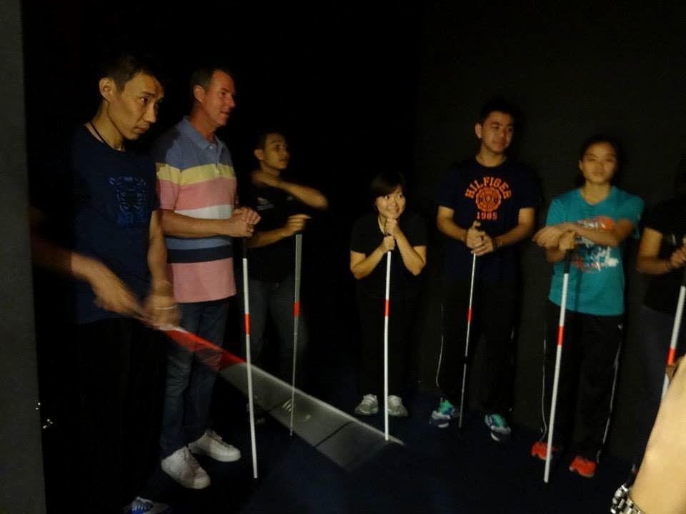 malaysian badminton players during their dialogue in the dark exhibition