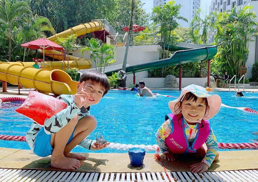 kids playing at the park royal resort pool areas